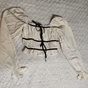 Chic Cream Blouse with Black Ribbon Details